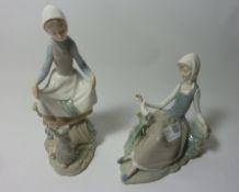 Two Lladro figurines - Lady with a dove and a Lady with a Rabbit, H 23.
