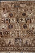 Keshan Super carpet, decorated with assorted panels and floral borders,