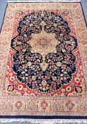 Persian Tabriz blue ground rug, large central medallion with floral field, signed,