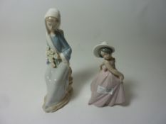 Two Lladro figurines - Seated lady with lilies, H 24cm and 'Iris' No.