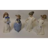 Four Nao figurines, two girls in white dresses,