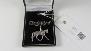 Silver dressage brooch and a similar horseshoe brooch stamped sterling 925 Condition