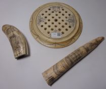 Replica tusk and tooth with Scrimshaw type decoration and a similar solitaire board