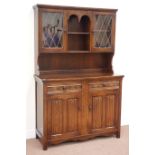 20th century oak dresser fitted with two drawers and two cupboard with raised display cabinets