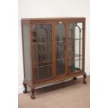 20th century walnut display cabinet, enclosed by two astragal glazed door, strap work to the frieze,