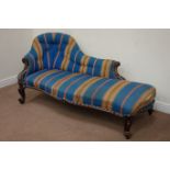 Victorian rosewood serpentine upholstered chaise longue, raised on carved scroll feet.