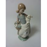 Lladro figure of a lady with flower basket holding a lamb H 25cm Condition Report