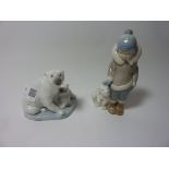 Two Lladro figurines - Eskimo Boy with Pet Polar Bear and a group of Polar bears