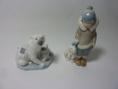 Two Lladro figurines - Eskimo Boy with Pet Polar Bear and a group of Polar bears