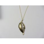 Modernist 9ct gold pendant set with a pearl hallmarked approx 4gm on gold-plated chain stamped 925