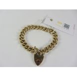 Heavy 9ct gold flattened link bracelet with heart locket Birmingham 1973 approx 62gm