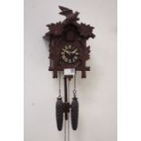 Black forest style carved cuckoo wall hanging clock CLOCKS & BAROMETERS - as we are not a retailer,