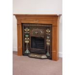 Victorian style cast iron fire inset fitted with Art Nouveau inspired tiles,