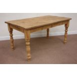 Waxed pine rectangular dining table raised on turned base, 153cm x 88cm,