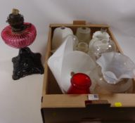 Victorian oil lamp with cranberry glass well and various vintage glass shades Condition