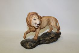 Beswick lion on rocky base