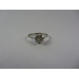 Single stone diamond flower set ring stamped 750 Condition Report <a