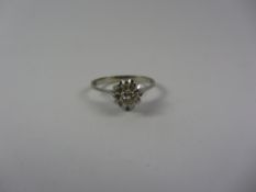 Single stone diamond flower set ring stamped 750 Condition Report <a