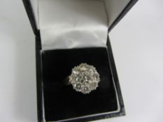 Nine stone diamond cluster ring stamped 18k diamonds approx 2 carats Condition Report