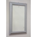 Moulded silver framed mirror fitted with bevelled glass,