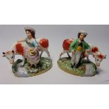 A pair of Staffordshire figures with cows, H14.