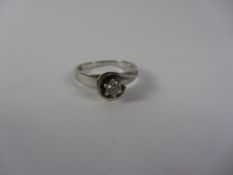 Single stone diamond white gold ring stamped 750 Condition Report <a