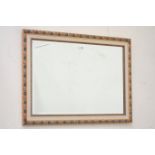 Wall mirror, with floral decoration, enclosing bevelled glass plate,