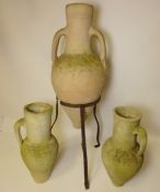 Three composite stone garden urns with tripod frame Condition Report <a