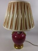 Porcelain table lamp with gilt and moulded lion decoration,