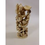 Meiji period Japanese Ivory Okimono carving of a Fisherman holding a fish and surrounded by