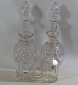 A pair of Edwardian cut glass decanters and two 19th century cut glass decanters