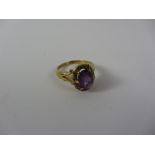 Amethyst and diamond cluster gold ring the fancy shank hallmarked 18ct Condition Report