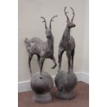 Pair cast metal garden stags on spherical mounts, figures/gate post finials,