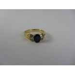 Sapphire and baguette diamond gold ring stamped 750 Condition Report <a