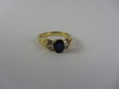 Sapphire and baguette diamond gold ring stamped 750 Condition Report <a