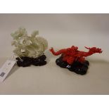 Chinese Jade carving of a lady and child with lotus flowers riding a phoenix and a coral carving of