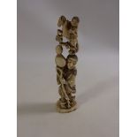 19th Century Japanese carved ivory Okimono of a figure with a man on horse emerging from a vessel