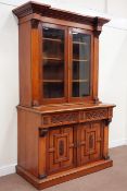 Victorian walnut bookcase on cupboard enclosed by two glazed doors raised upon panelled cupboards