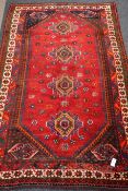 Persian Shiraz red ground rug, 250cm x 161cm Condition Report <a href='//www.