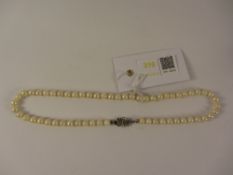 Cultured pearl necklace the clasp with inset ruby stamped 750 Condition Report