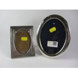 Modern oval silver photo frame and another silver photo frame,