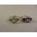 Amethyst and garnet set ring and a rutilite set ring both stamped 925 Condition Report
