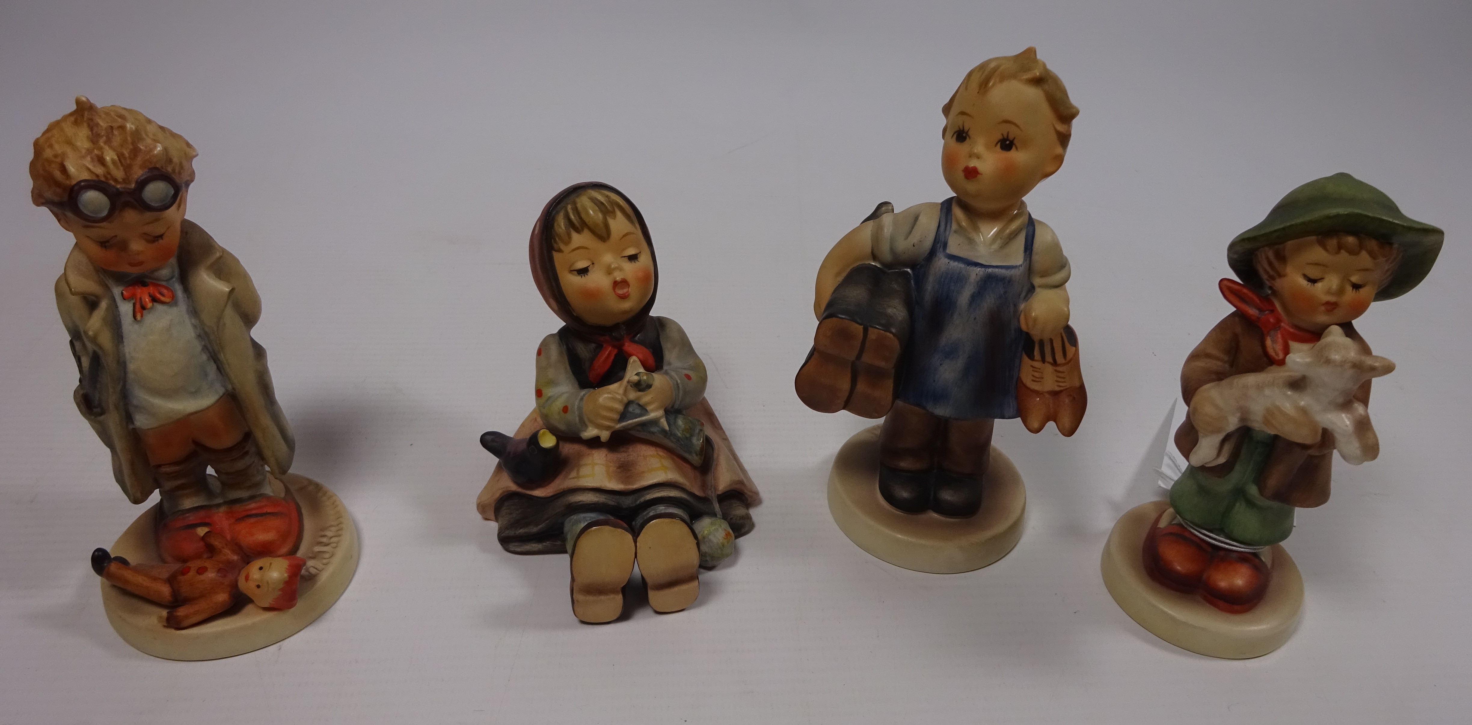 Four Goebel Hummel figures Condition Report <a href='//www.davidduggleby.