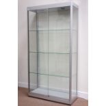 Metal and glazed illuminated display cabinets enclosed by two sliding doors,