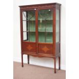 Edwardian inlaid mahogany display cabinet enclosed by two astragal glazed doors,