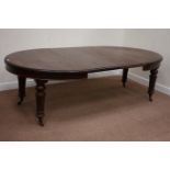 Victorian mahogany telescopic dining table with two leaves, raised on turned and fluted legs,