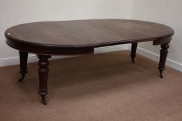 Victorian mahogany telescopic dining table with two leaves, raised on turned and fluted legs,