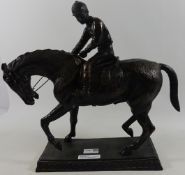 Large cast metal sculpture of a jockey riding a horse Condition Report <a