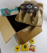 Bell & Howell Lumina II 8mm projector, boxed with three films; Charlie Chaplin,