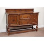 Early 20th century oak sideboard fitted with three central drawers flanked by cupboards,